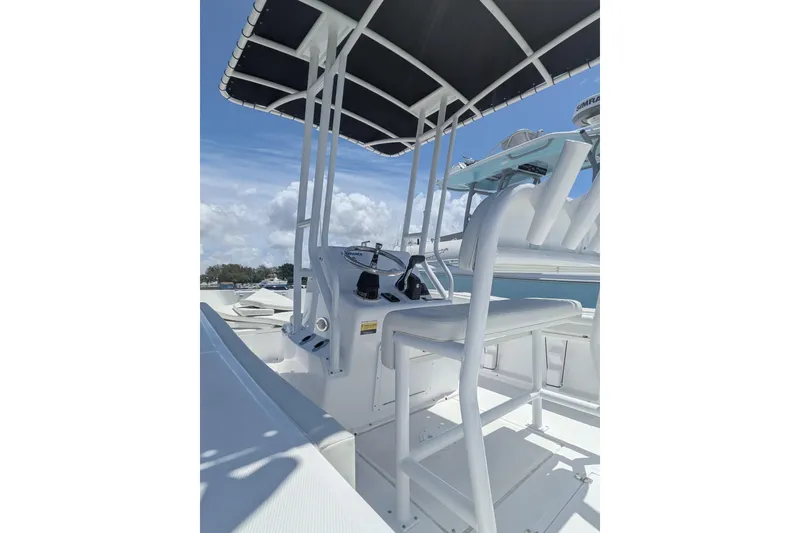 Slide: The Image of 2026 Clearwater 2000 Center Console boat with T-top and helm station. - 7