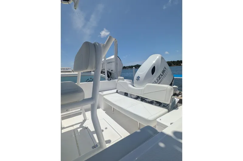 Slide: The Image of 2026 Clearwater 2000 Center Console boat with Suzuki outboard motor on a sunny day. - 8