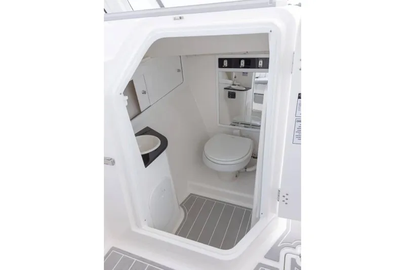 Slide: The Image of Manufacturer Provided Image: Interior of 2025 Sea Fox 288 Traveler boat bathroom with toilet and sink. - 10