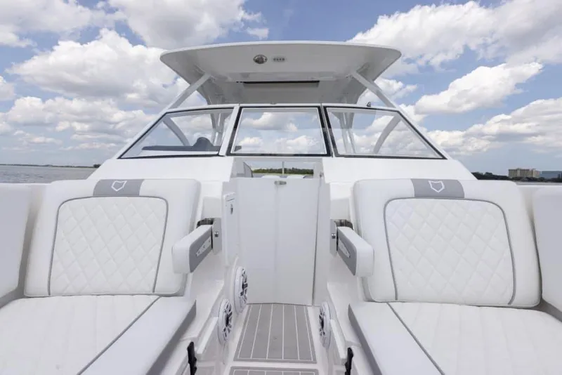 Slide: The Image of Manufacturer Provided Image: 2025 Sea Fox 288 Traveler boat interior with white seating and open water view. - 4