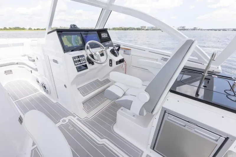 Slide: The Image of Manufacturer Provided Image: 2025 Sea Fox 288 Traveler boat interior with modern helm and seating. - 6