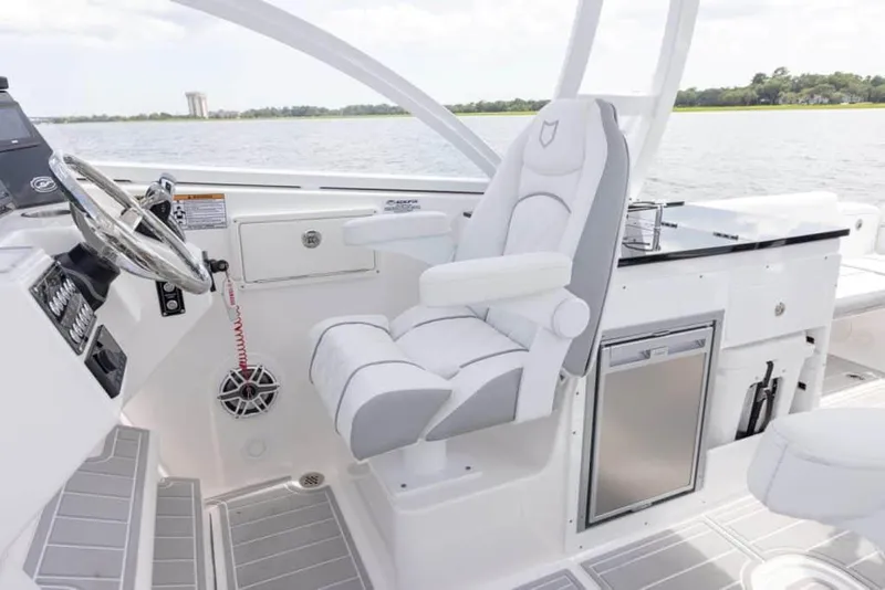 Slide: The Image of Manufacturer Provided Image: 2025 Sea Fox 288 Traveler boat interior with captain's chair and control panel. - 7