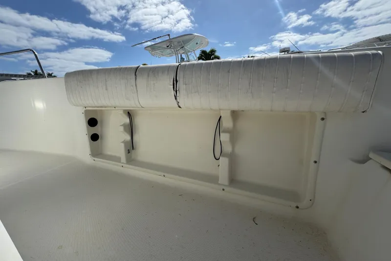 Slide: The Image of 2002 Hydra-Sports 212 CC boat interior with white seating and storage compartments. - 12