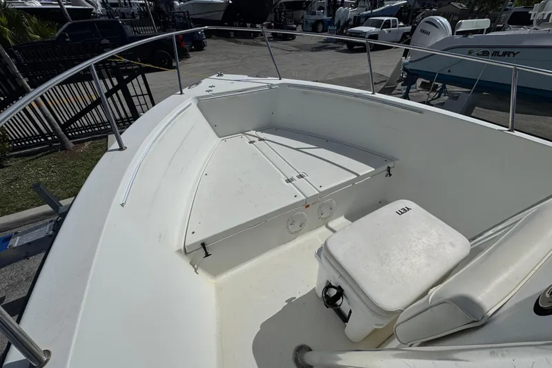 Slide: The Image of 2002 Hydra-Sports 212 CC boat deck with seating and storage compartments. - 4