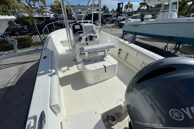 Slide: The Image of 2002 Hydra-Sports 212 CC boat interior with Yamaha engine, docked at marina. - 5