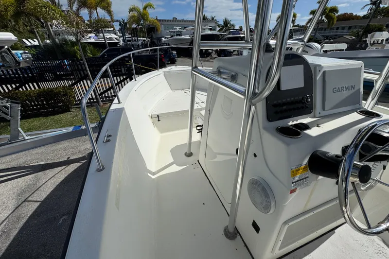 Slide: The Image of 2002 Hydra-Sports 212 CC boat interior with Garmin navigation system, docked under sunny skies. - 7