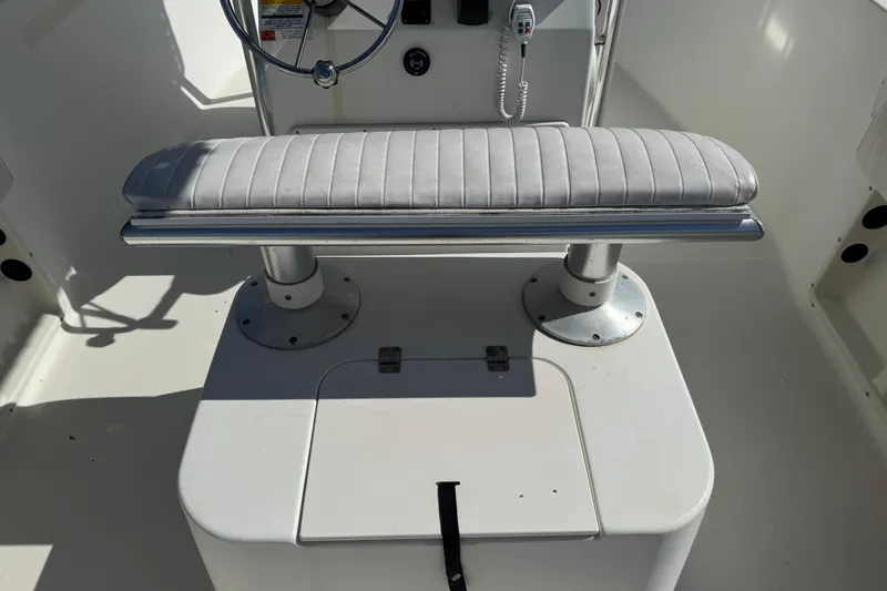 Slide: The Image of 2002 Hydra-Sports 212 CC boat interior with steering wheel and cushioned seat. - 8