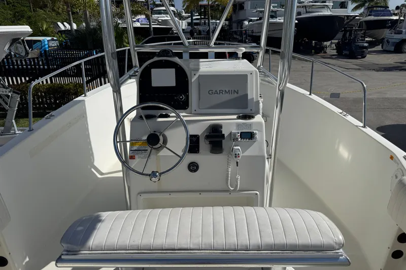 Slide: The Image of 2002 Hydra-Sports 212 CC boat console with Garmin navigation system and steering wheel. - 9
