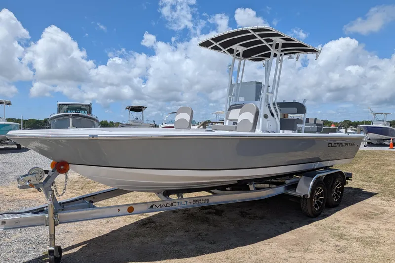 The Image of 2026 Clearwater 21 Bay boat on trailer under blue sky. - 0