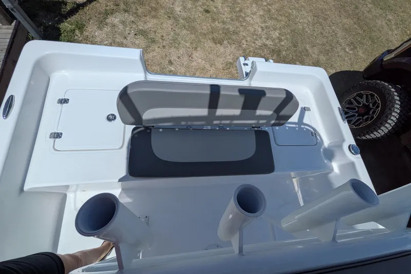 Slide: The Image of 2026 Clearwater 21 Bay boat interior with seating and storage compartments. - 10