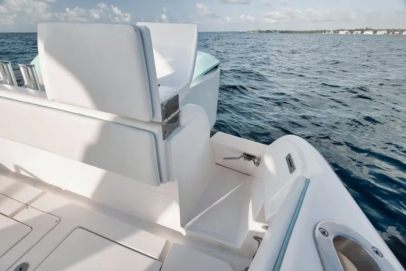 Slide: The Image of 2018 Intrepid 390 Sport Yacht with spacious deck and modern controls on open water. - 51