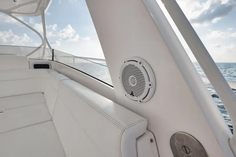 Slide: The Image of 2018 Intrepid 390 Sport Yacht with triple engines on blue ocean water. - 52