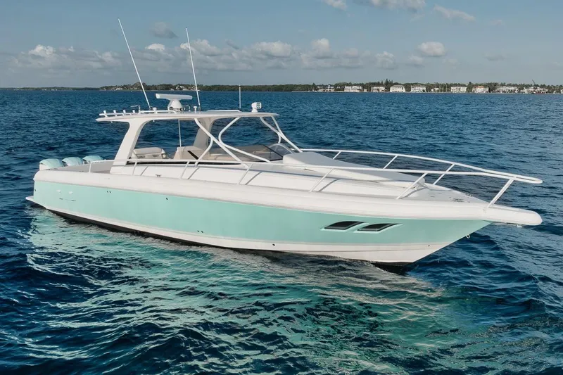Slide: The Image of 2018 Intrepid 390 Sport Yacht on blue ocean, clear sky background. - 11
