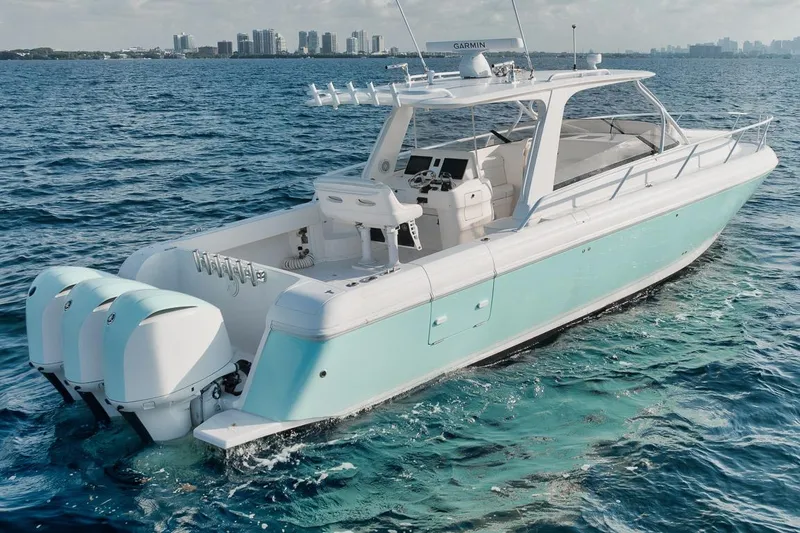 Slide: The Image of 2018 Intrepid 390 Sport Yacht cruising on blue ocean waters. - 15