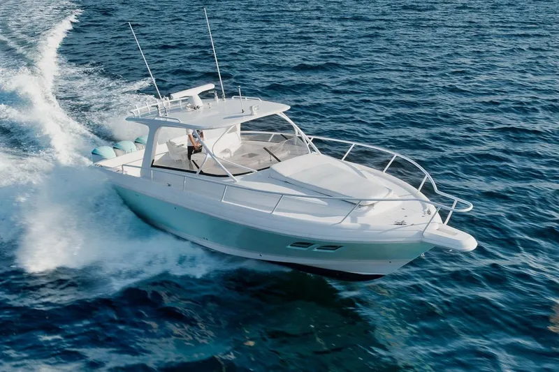 Slide: The Image of 2018 Intrepid 390 Sport Yacht cruising on open water. - 17