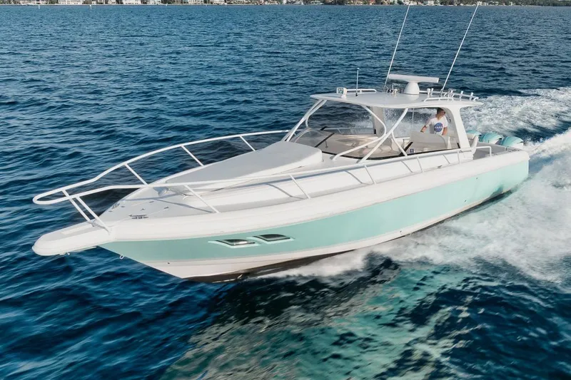 Slide: The Image of 2018 Intrepid 390 Sport Yacht cruising on open water. - 2