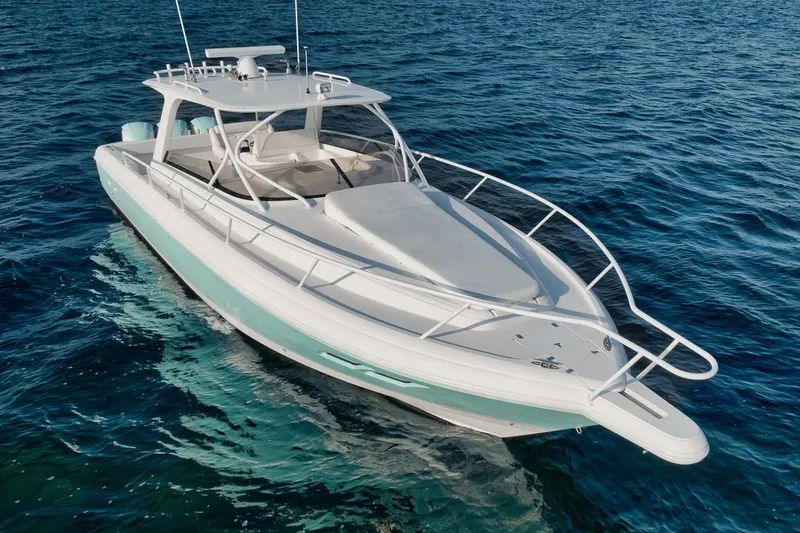 Slide: The Image of 2018 Intrepid 390 Sport Yacht cruising on clear blue ocean waters. - 21