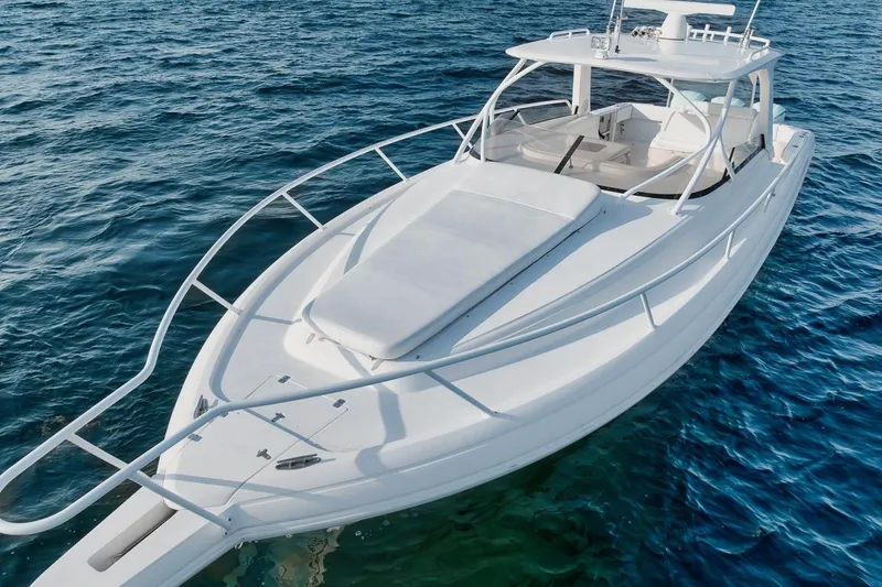 Slide: The Image of 2018 Intrepid 390 Sport Yacht on calm blue ocean waters. - 22