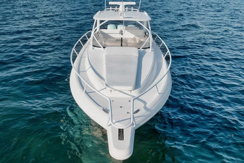Slide: The Image of 2018 Intrepid 390 Sport Yacht on clear blue water, aerial view. - 23