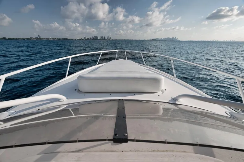 Slide: The Image of Bow view of 2018 Intrepid 390 Sport Yacht cruising on open water. - 24