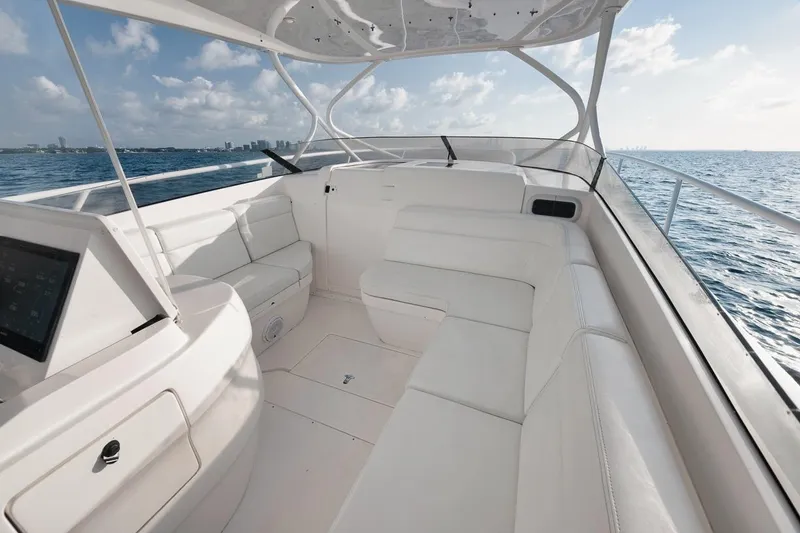 Slide: The Image of Luxurious 2018 Intrepid 390 Sport Yacht interior with white seating, ocean view, and modern design. - 27