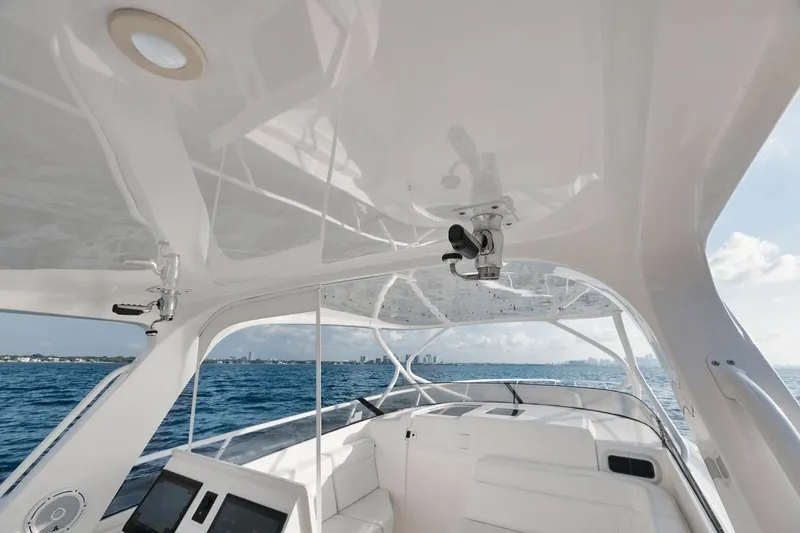 Slide: The Image of 2018 Intrepid 390 Sport Yacht interior with ocean view, showcasing sleek design and modern features. - 34