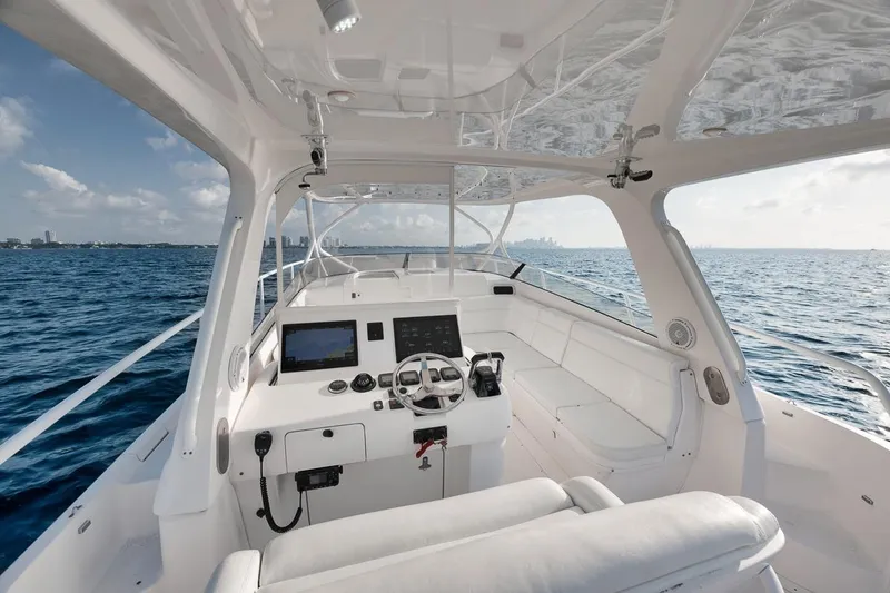 Slide: The Image of Cockpit view of 2018 Intrepid 390 Sport Yacht on open sea, featuring modern controls. - 35