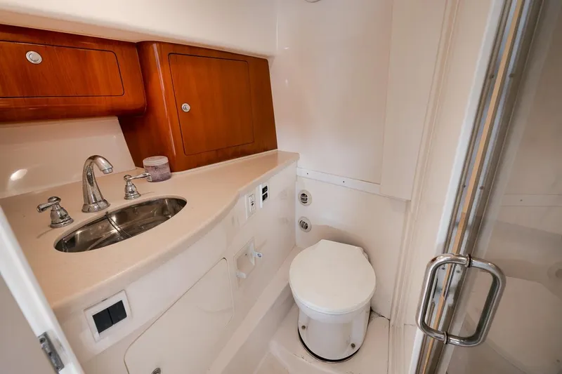 Slide: The Image of Luxurious bathroom in 2018 Intrepid 390 Sport Yacht with sink and toilet. - 44