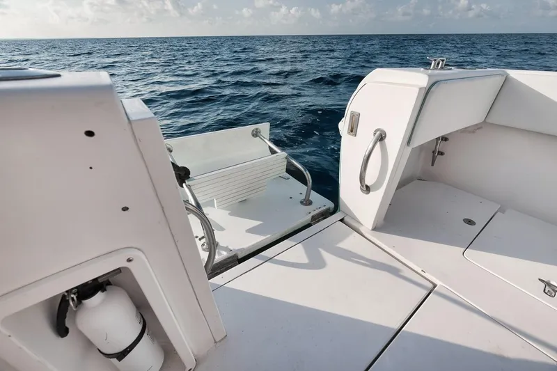 Slide: The Image of 2018 Intrepid 390 Sport Yacht deck with ocean view and safety equipment. - 50