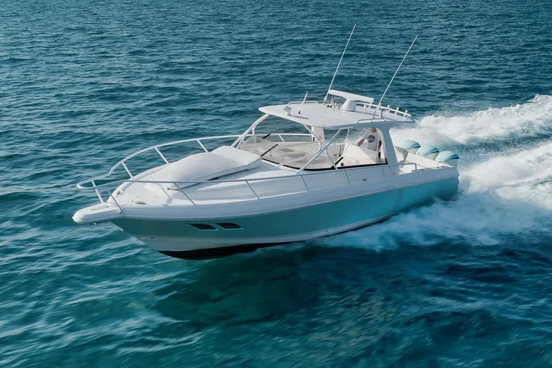 Slide: The Image of 2018 Intrepid 390 Sport Yacht cruising on open blue waters. - 6