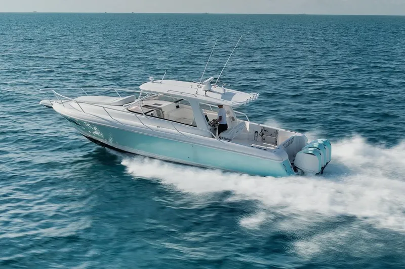 Slide: The Image of 2018 Intrepid 390 Sport Yacht cruising on open ocean waters. - 60