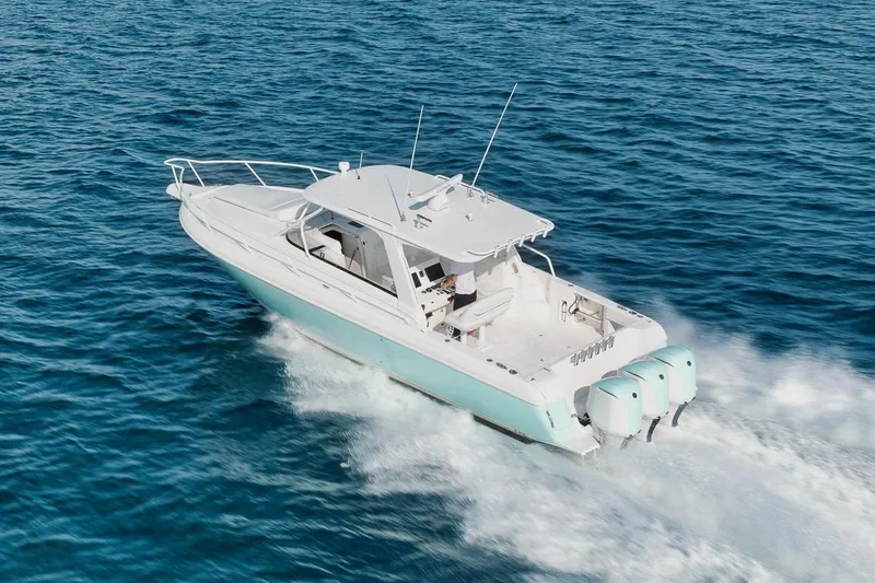 Slide: The Image of 2018 Intrepid 390 Sport Yacht cruising on open blue water. - 7