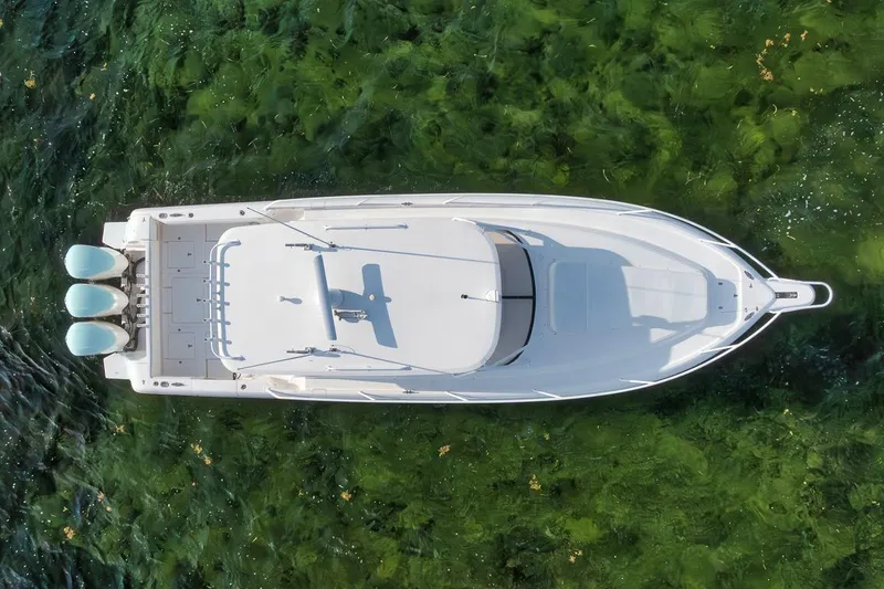 Slide: The Image of Aerial view of 2018 Intrepid 390 Sport Yacht on clear green water. - 8