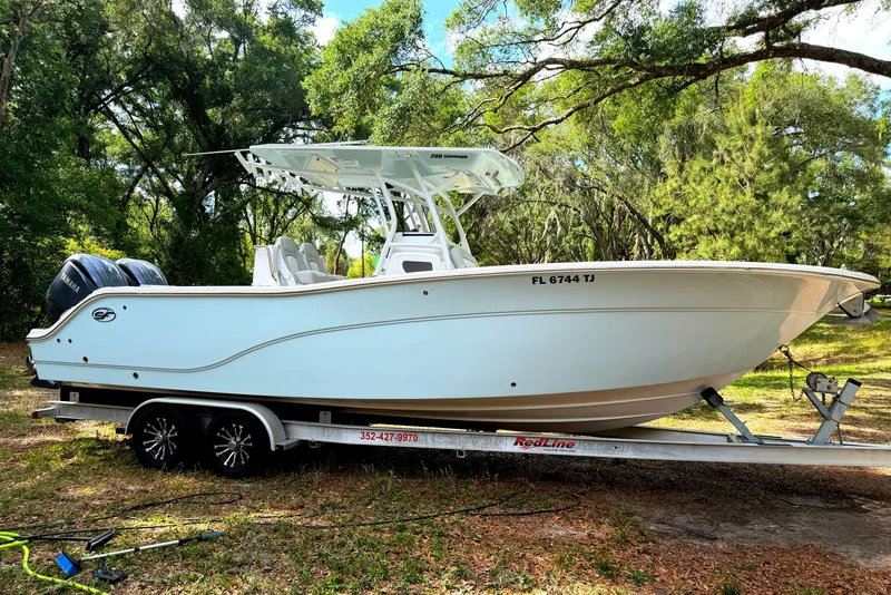 The Image of 2023 Sea Fox 288 Commander boat on trailer in wooded area. - 0