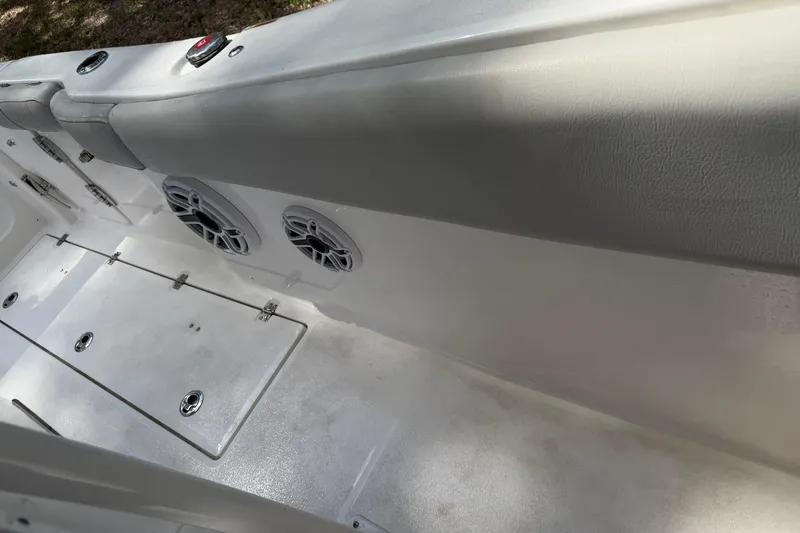 Slide: The Image of Interior view of 2023 Sea Fox 288 Commander boat, featuring speakers and storage compartments. - 13