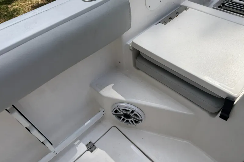 Slide: The Image of Interior view of 2023 Sea Fox 288 Commander boat, featuring seating and speaker. - 14