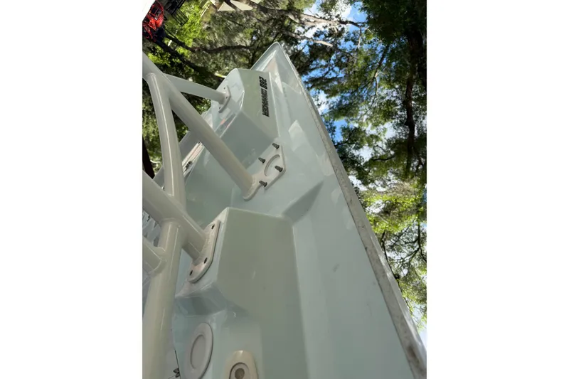 Slide: The Image of 2023 Sea Fox 288 Commander boat detail with trees and sky in the background. - 18