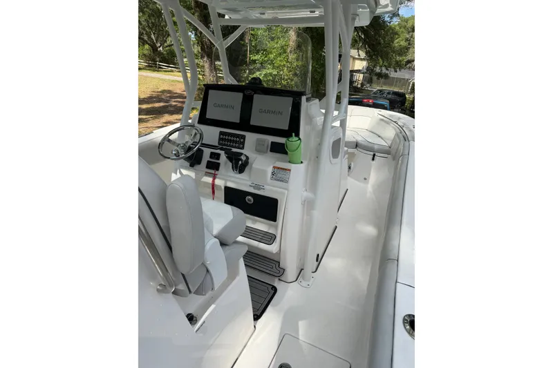 Slide: The Image of 2023 Sea Fox 288 Commander boat cockpit with Garmin displays and seating. - 21