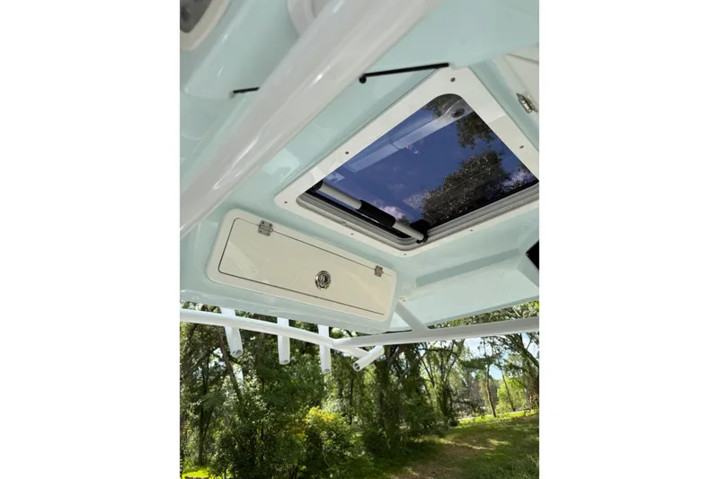 Slide: The Image of 2023 Sea Fox 288 Commander boat interior with hatch and rod holders. - 22