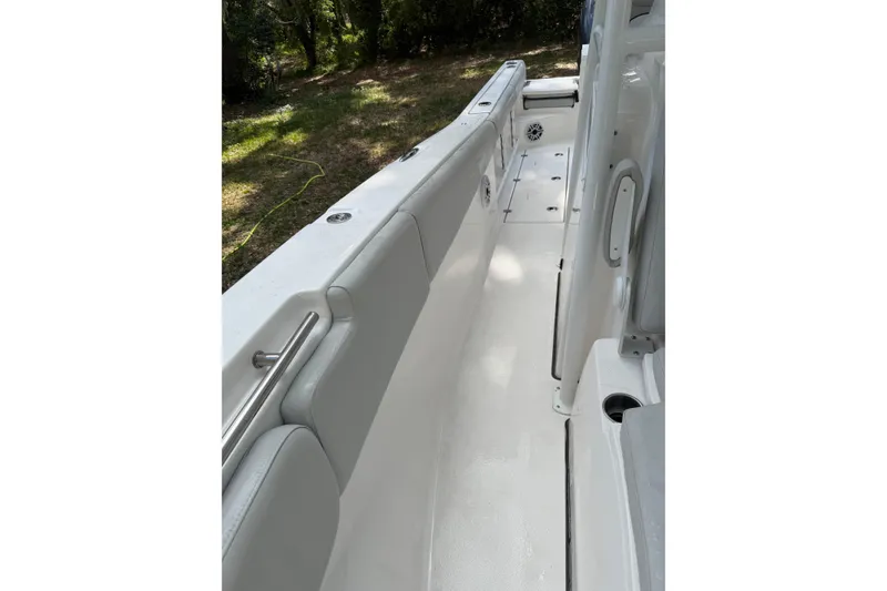 Slide: The Image of 2023 Sea Fox 288 Commander boat interior with cushioned seating and sleek design. - 23
