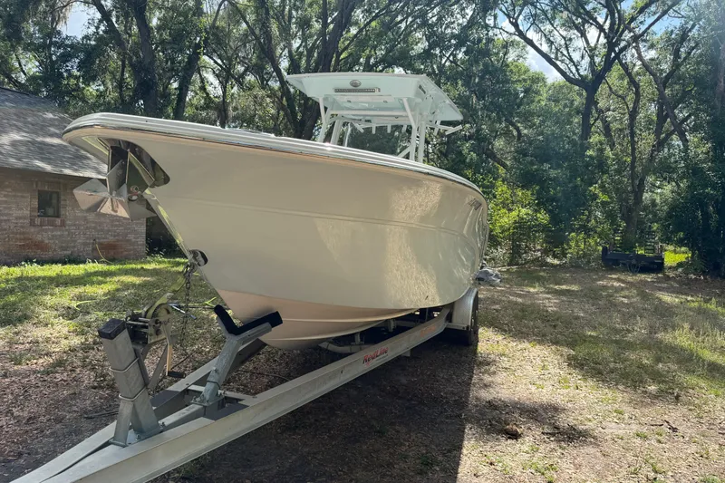 Slide: The Image of 2023 Sea Fox 288 Commander boat on trailer in wooded area. - 3