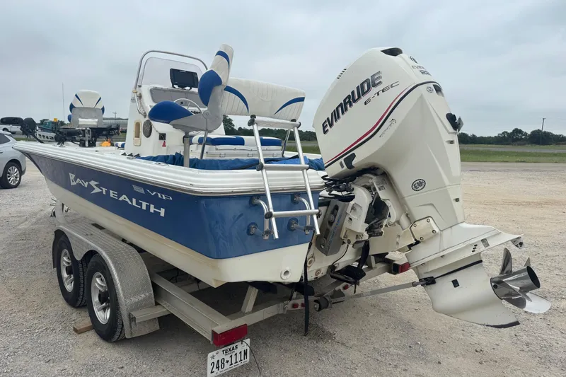 Slide: The Image of 2007 Bay Stealth 2230 boat with Evinrude E-TEC motor on a trailer. - 3