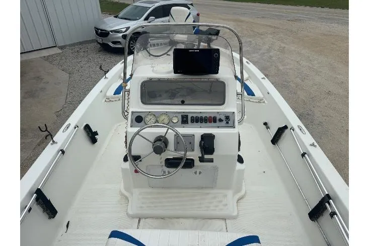 Slide: The Image of 2007 Bay Stealth 2230 boat interior with steering console and navigation equipment. - 5