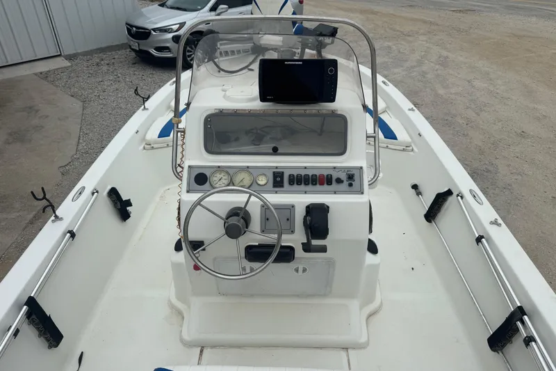 Slide: The Image of 2007 Bay Stealth 2230 boat interior with steering wheel and control panel. - 6