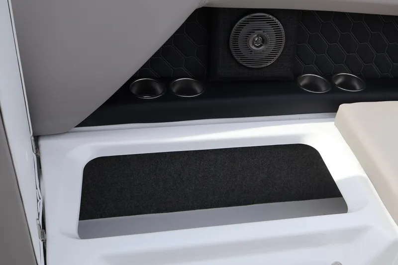 Slide: The Image of Interior of 2026 Four Winns H4 boat with cup holders and speaker. - 16