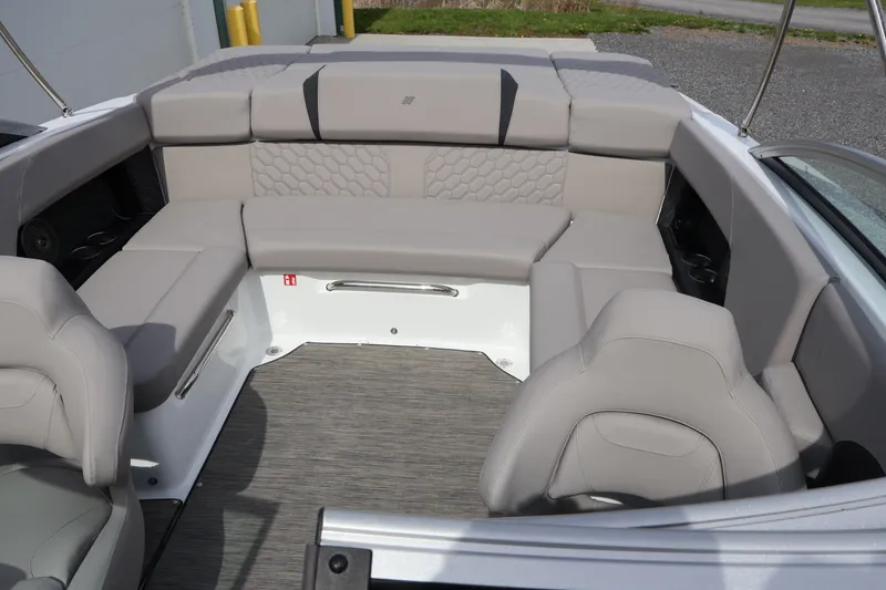 Slide: The Image of 2026 Four Winns H4 boat interior with gray seating and modern design. - 21
