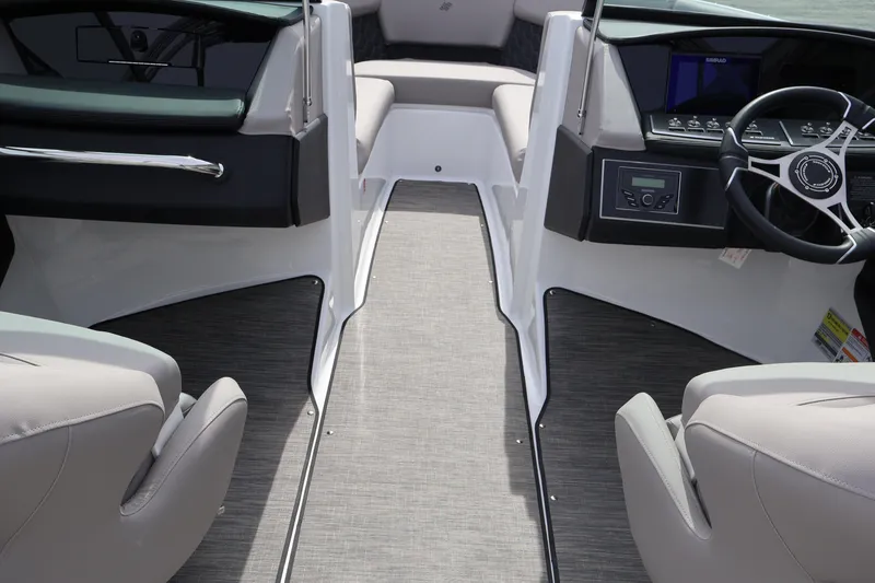 Slide: The Image of Interior view of 2026 Four Winns H4 boat, featuring modern dashboard and seating. - 23