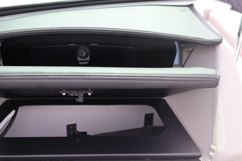 Slide: The Image of Open storage compartment in 2026 Four Winns H4 boat interior. - 24