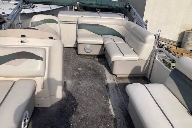 Slide: The Image of Interior of a 2010 Sweetwater Tuscany 2086 pontoon boat with white seating. - 10