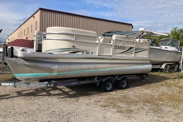 Slide: The Image of 2010 Sweetwater Tuscany 2086 pontoon boat on trailer, parked outdoors. - 3